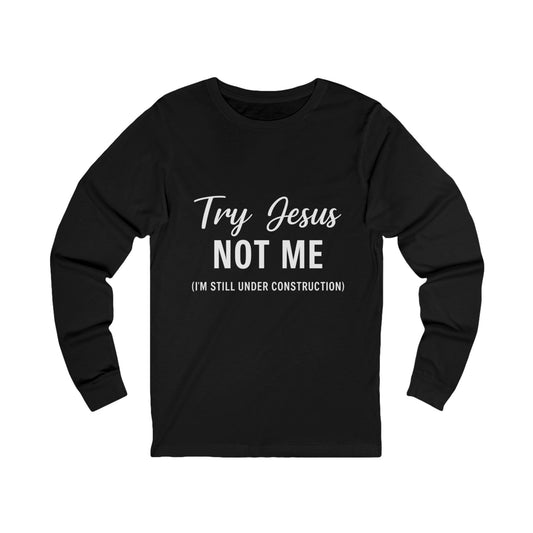 “Try Jesus, Not Me.” Long‑Sleeve Tee – “I’m Still Under Construction” Faith Statement Shirt (Unisex)